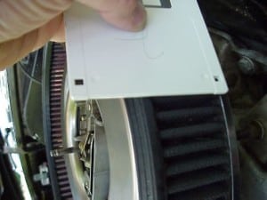Floppy disk held against the air filter.